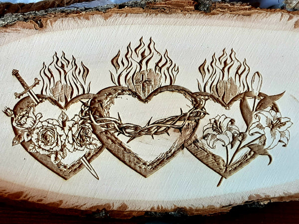 3 three Hearts Wooden Wall Plaque. Joseph, Mary, Jesus. Sword, crown of thorns, lily. Close up. 