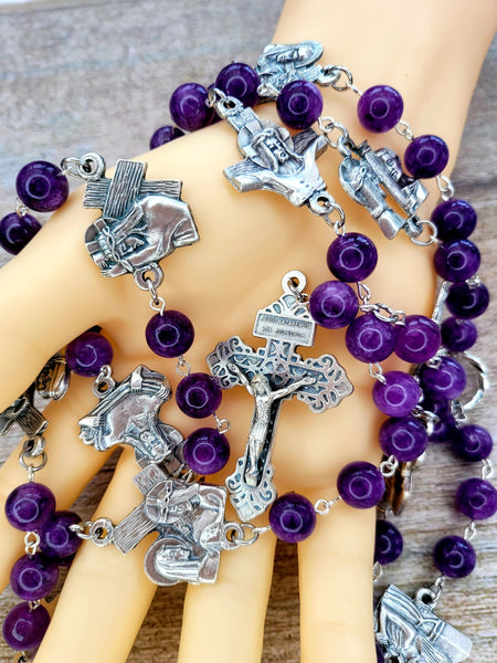 Stations of the cross rosary purple in hand